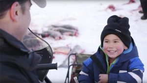 Xyler Goodwin teaching Sean how to Ice Fish